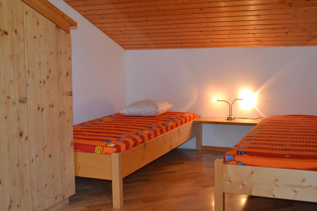 Postel nebo postele na pokoji v ubytování Alpensonne