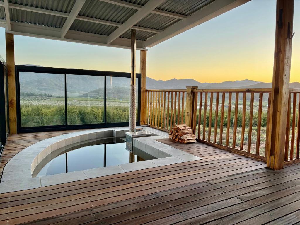a pool on a deck with a view at Emmie's Cottage in Rietvlei Number 1