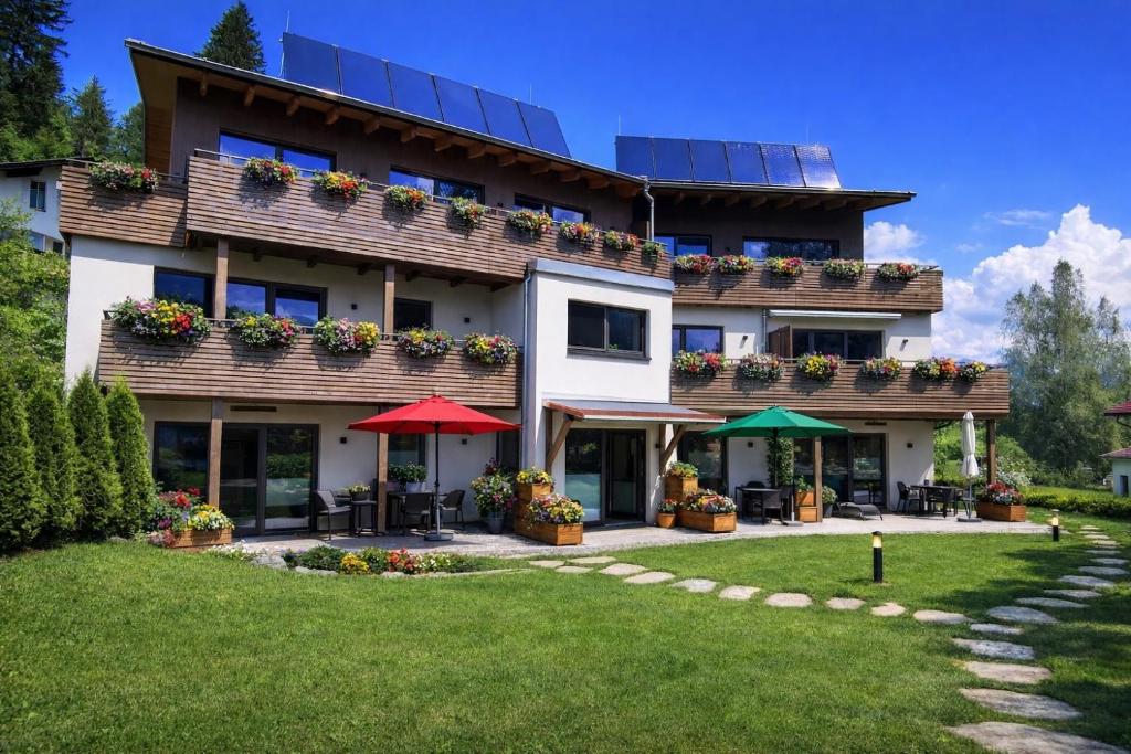 a house with solar panels on the roof at Lechappart in Hofen