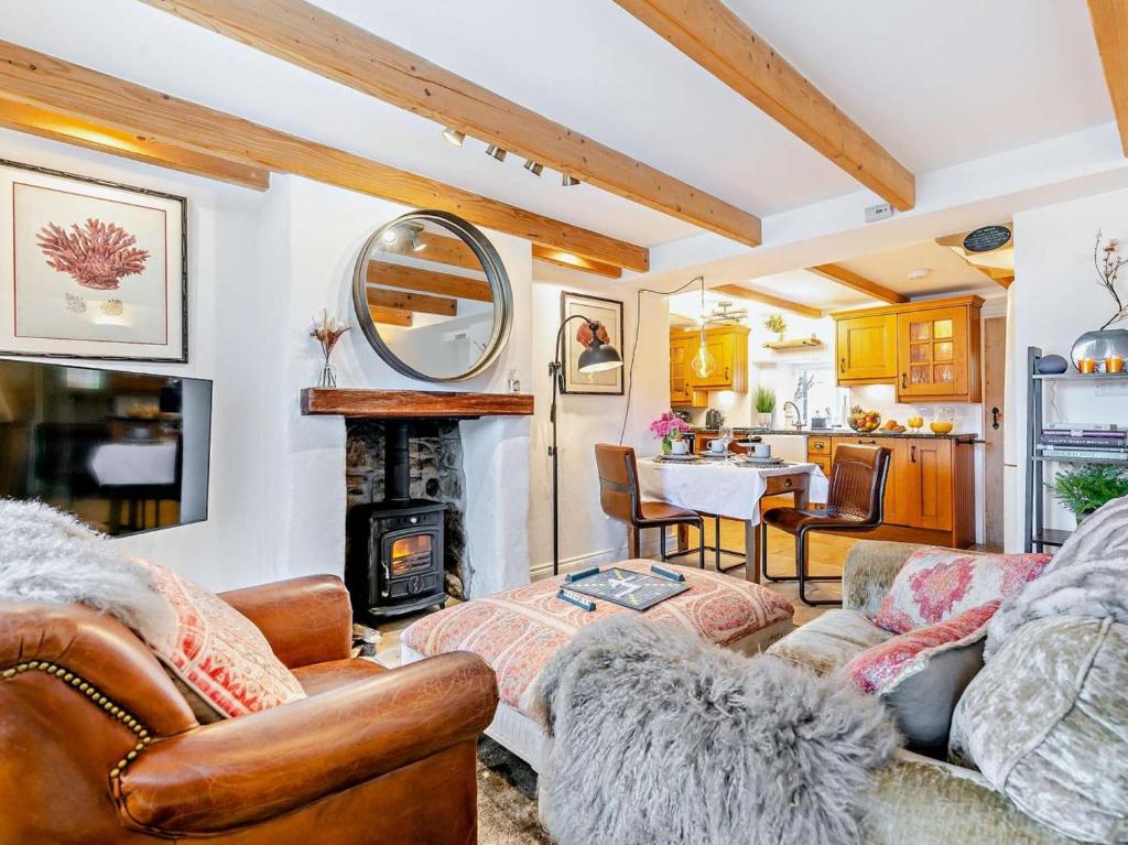 a living room with a couch and a fireplace at 2 Bed in Hayle oc-90552 in Phillack
