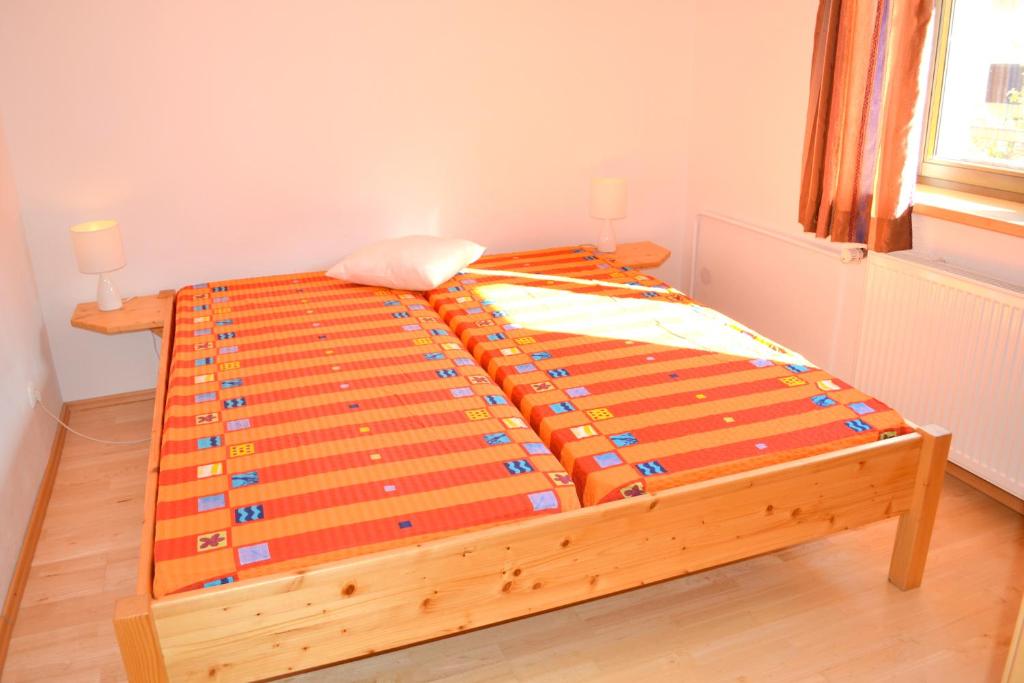 Postel nebo postele na pokoji v ubytování Alpensonne