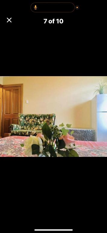 a picture of a bedroom with a bed and a couch at Less pay for master room in Rosewater