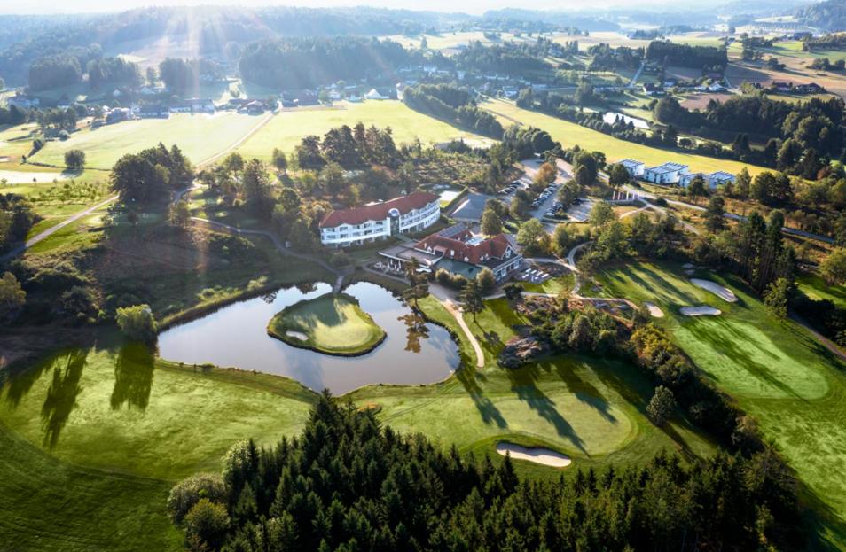 an aerial view of a mansion with a lake at Golfresort Haugschlag in Haugschlag