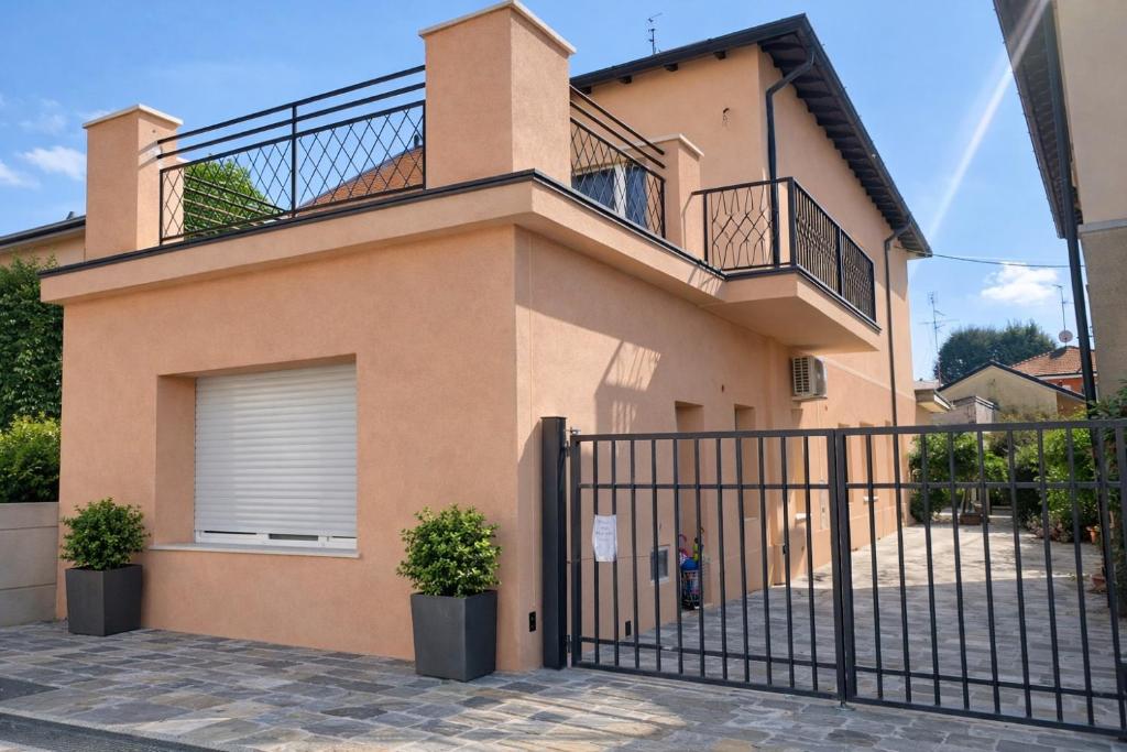 a house with a gate in front of it at Dreamhouse B&B in Pioltello