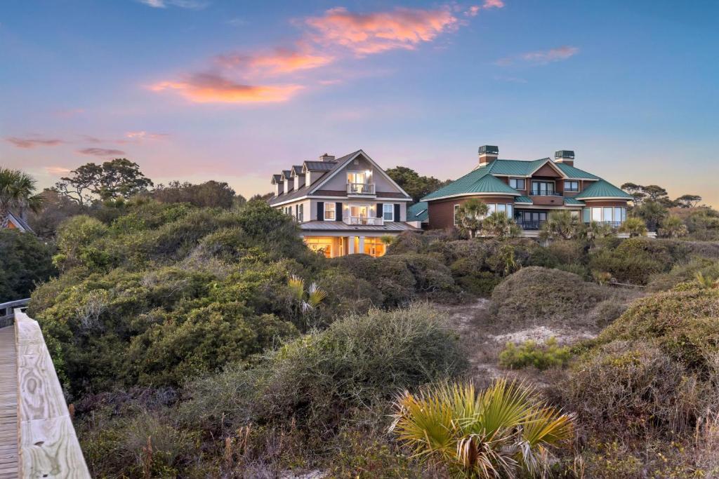 a house on top of a hill with bushes at EA1A: 1A Eugenia Avenue in Kiawah Island