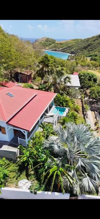 an aerial view of a house with a red roof at Creole Paradise beach wifi in Terre-de-Haut