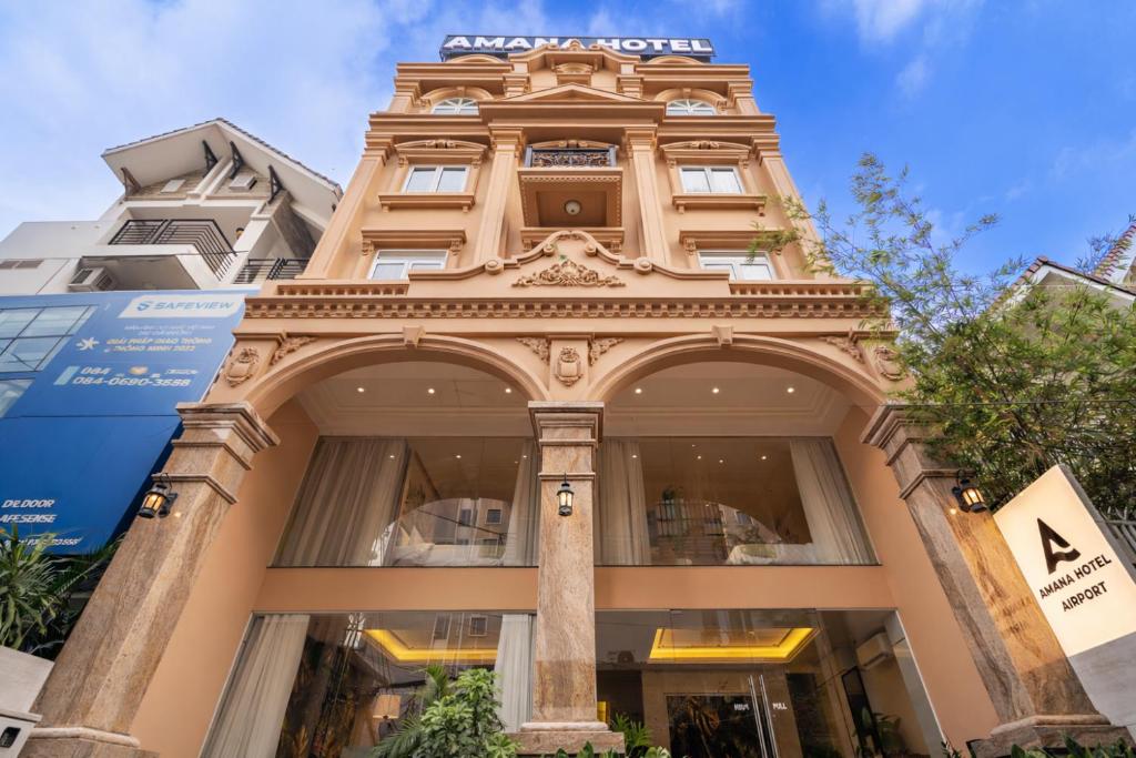 a building with an arch in front of it at Amana Hotel Airport in Ho Chi Minh City