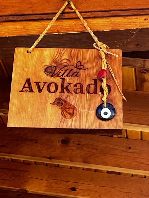 a sign that says dear avalanche hanging on a wall at Koruwoodenhouse Alanya Gazipaşa in Gazipasa
