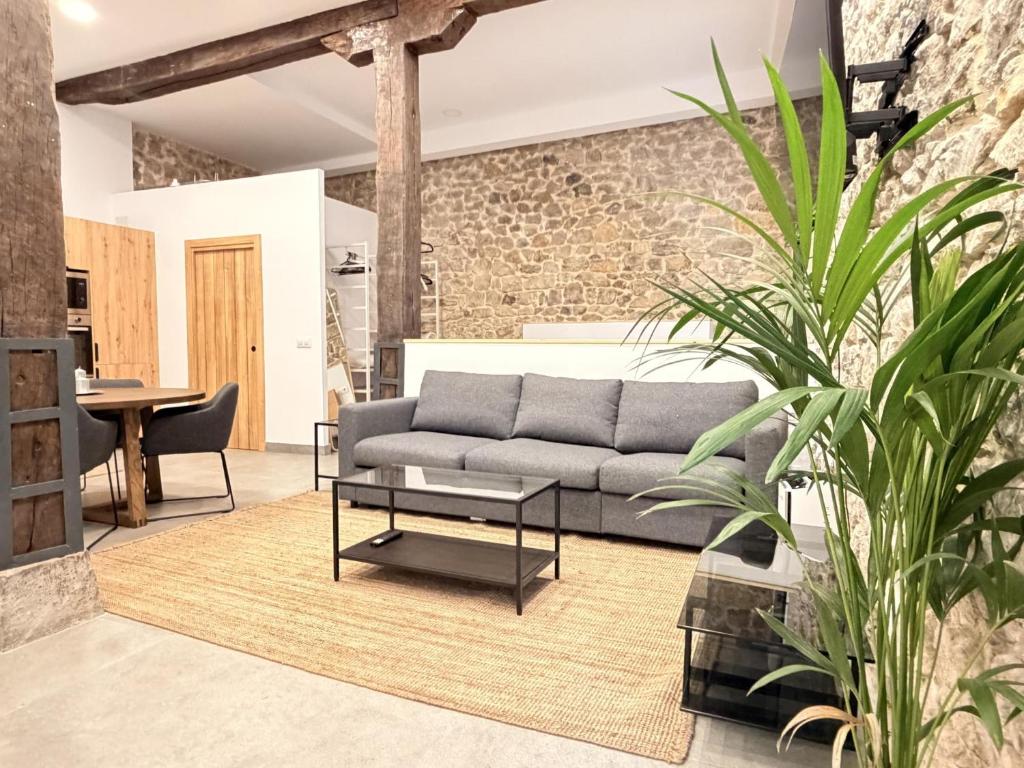 a living room with a couch and a table at Apartamento Calle Limón in Santander