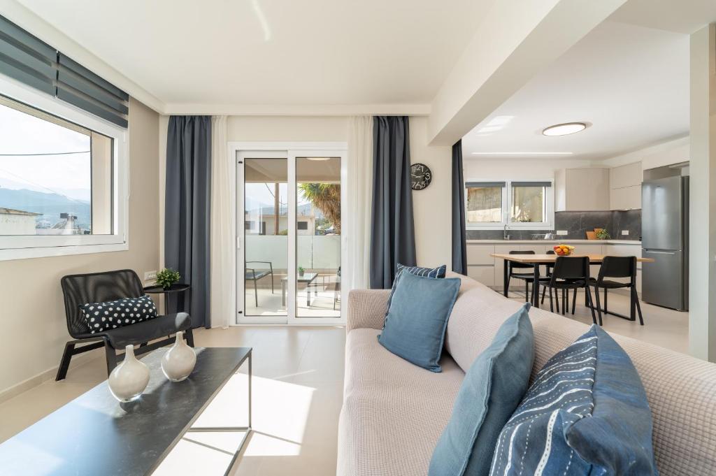 a living room with a couch and a table at M P A Luxury Apartment Α2 in Agios Nikolaos
