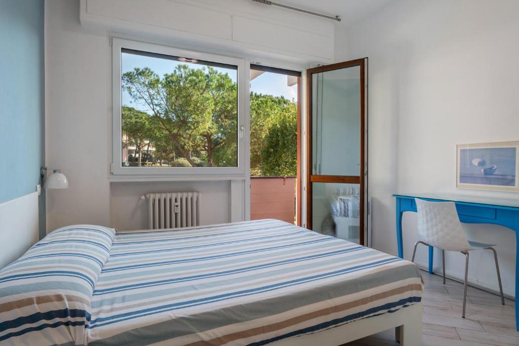 a bedroom with a bed and a window at Solaria in Rapallo