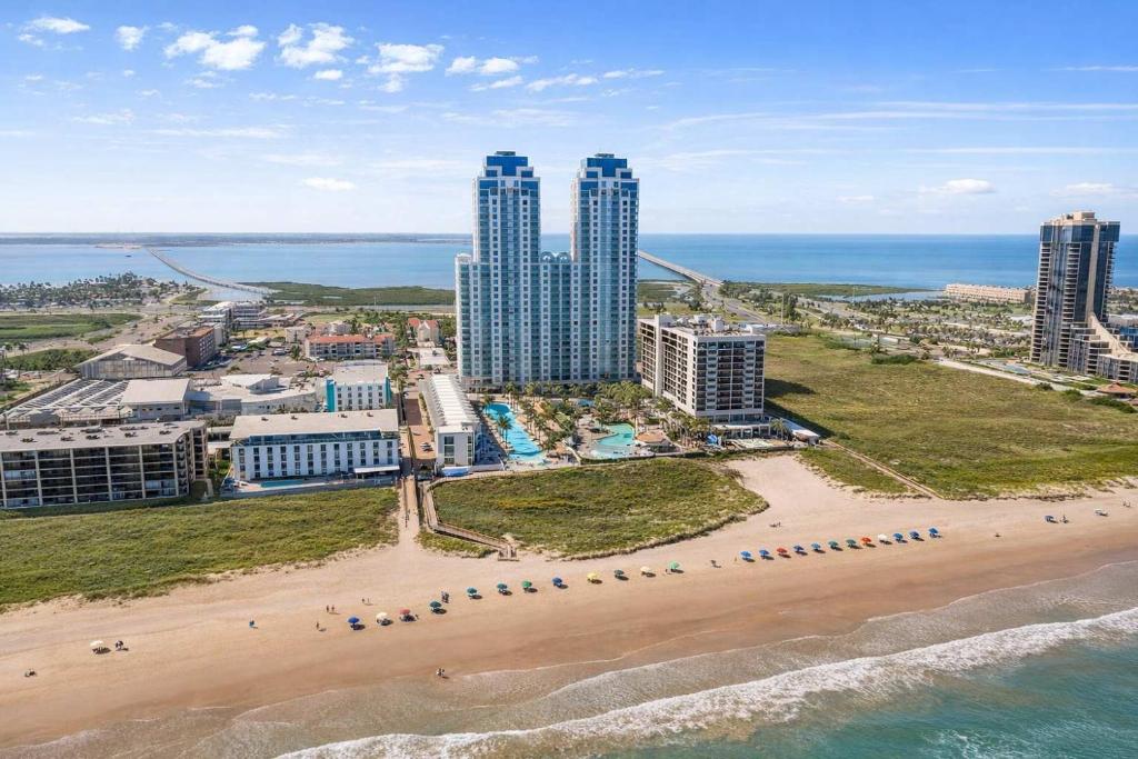 an aerial view of a beach with tall buildings at Sapphire Beach - Breathtaking 26th Floor Views in South Padre Island