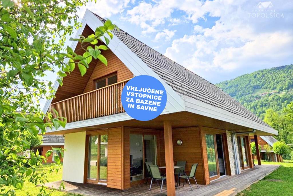 a building with a sign on the side of it at Apartment DREN near terme Topolšica in Topolšica
