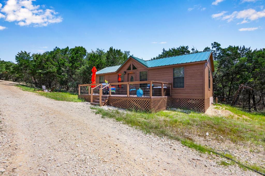 a small wooden cabin on a dirt road at Terlingua at the Bend in Wimberley