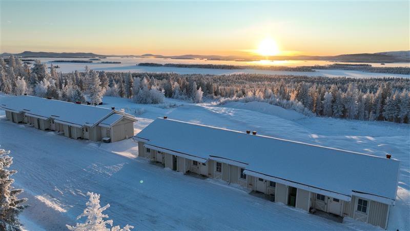 an aerial view of a building in the snow at Simloc Hotel Öberget in Arjeplog