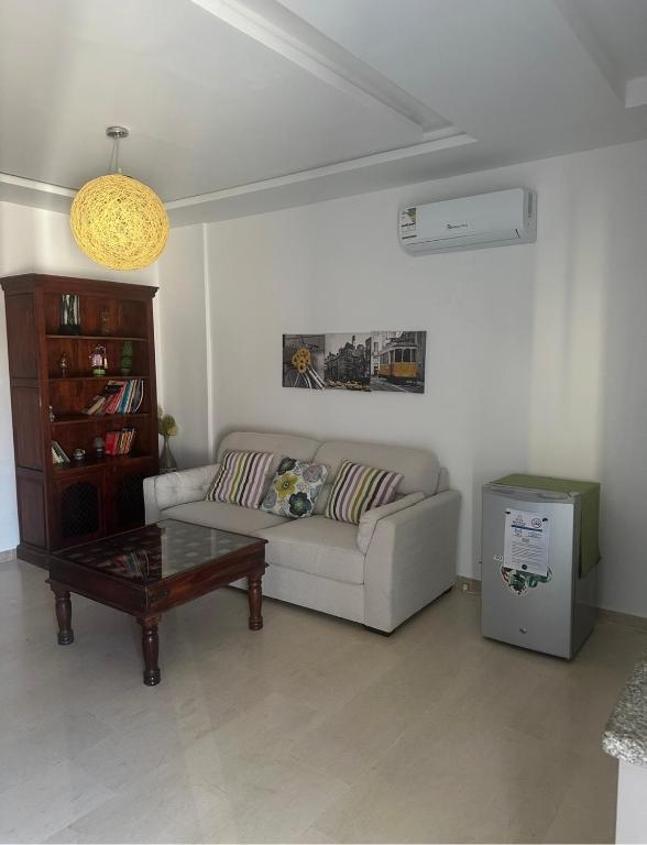 a living room with a couch and a coffee table at DIAR Soufa in Chott Meriem