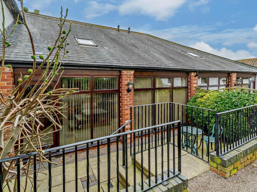 a brick house with a fence in front of it at 1 Bed in Doncaster oc-93769 in Mattersey
