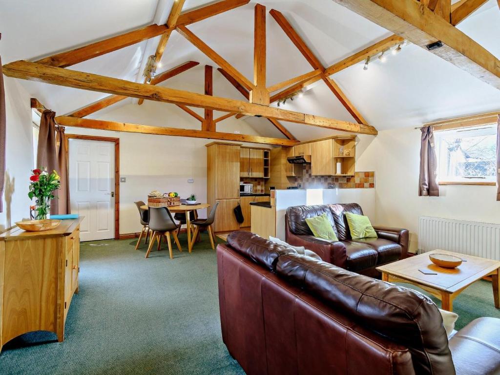 a living room with a couch and a table at 2 Bed in Doncaster oc-93771 in Mattersey
