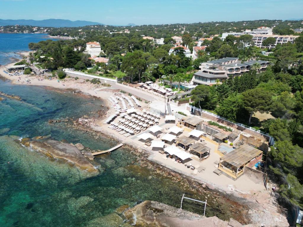 an aerial view of a beach with a resort at La Réserve Esterel in Saint-Raphaël