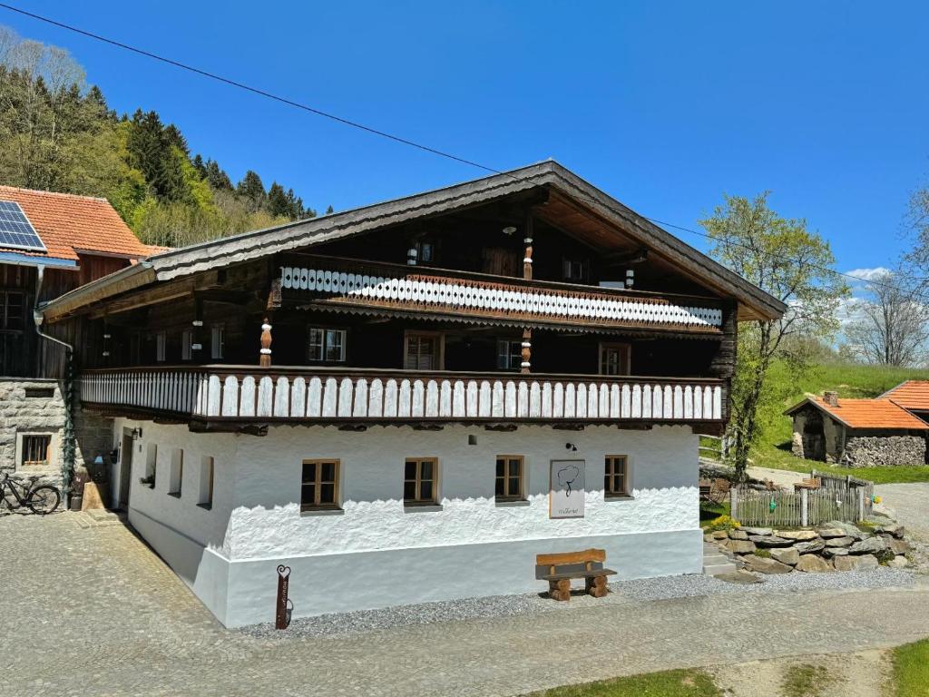 a large white building with a wooden roof at Waldlerhof in Patersdorf