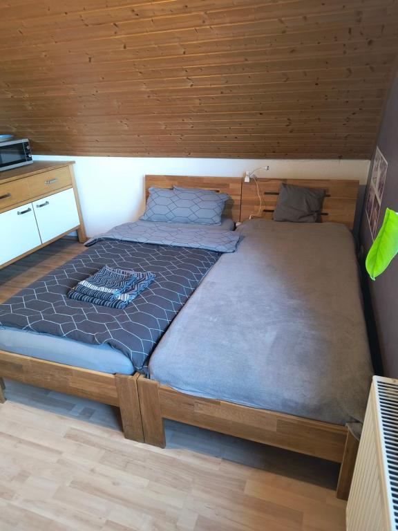 a bedroom with a large bed in a cabin at Auerandstudio in Nienhagen