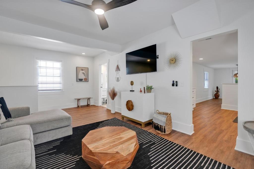 a living room with a couch and a table at Urban Oasis in Wilmington
