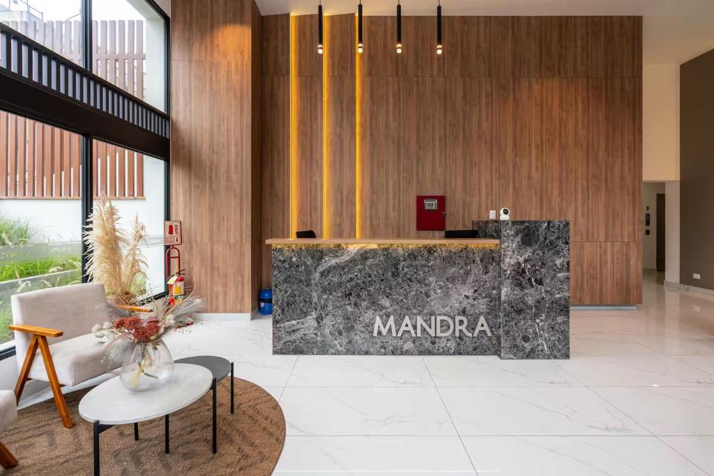 a lobby with a sign that reads mandapa at Ejército City Lofts & Apartments by Geko in Lima