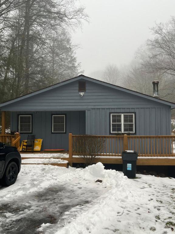a gray house with snow in front of it at Mountain home in Newland in Newland