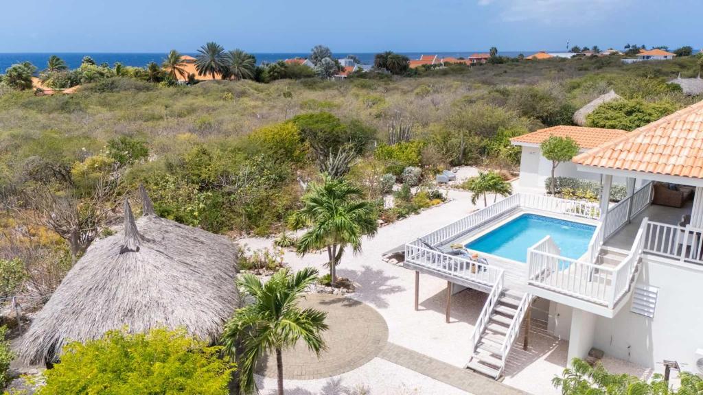 an aerial view of a house with a swimming pool at Villa Kas Karibense 38 - Coral Estate in Willibrordus