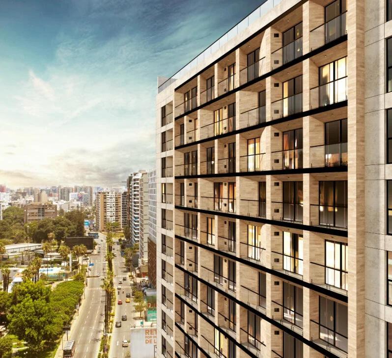 a tall building with a street in front of it at Perricholi Central Apartments by Geko in Lima