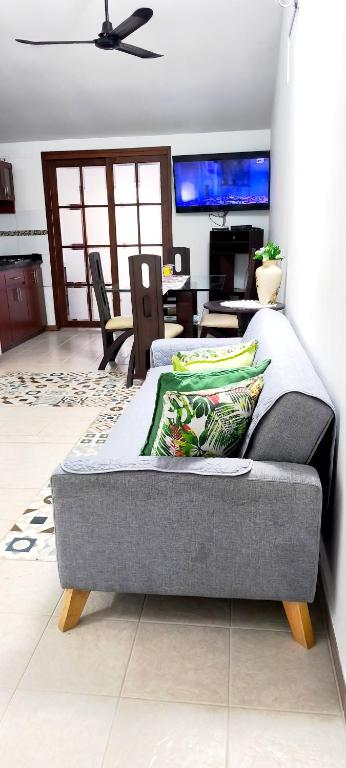 a bed in a room with a living room at Tu Estancia en Cali - Valle del Lili in Cali