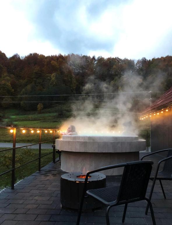 a fire pit with steam coming out of it at Apartments House Pylypets in Pilipets