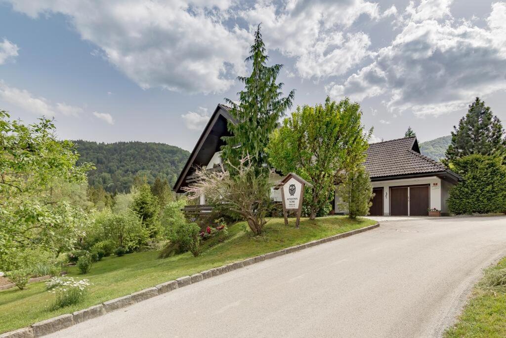 a house on the side of a road at ATMOSPHERE Apartments in Bled
