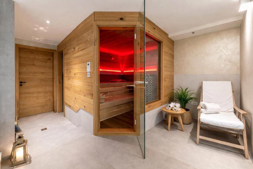 a walk in shower with a glass door in a room at Gostilna Lipan in Gorenja Vas