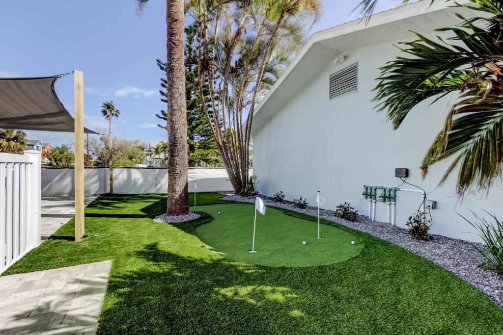 a miniature golf course in the backyard of a house at Indian Rocks Beach West Side Bungalow in Clearwater Beach