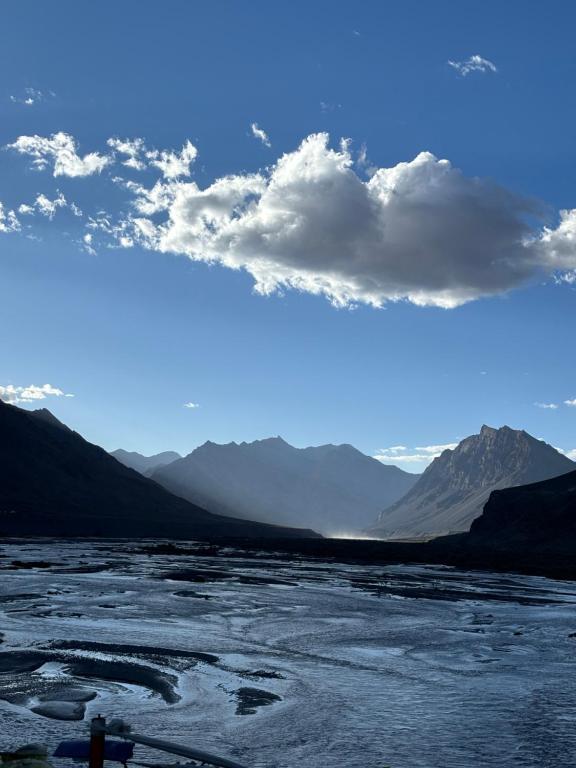 a view of a river with mountains in the background at Dungkhar homestay in Kaza