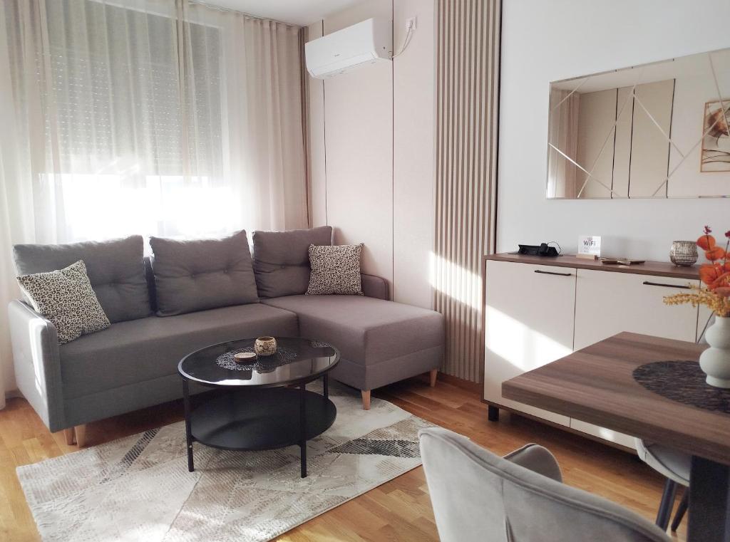 a living room with a couch and a table at City Studio in Smederevo