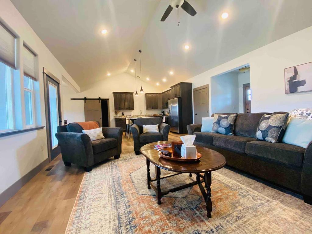 a living room with a couch and a coffee table at Comfy 4 Bdrm House with Air Conditioning in Corvallis