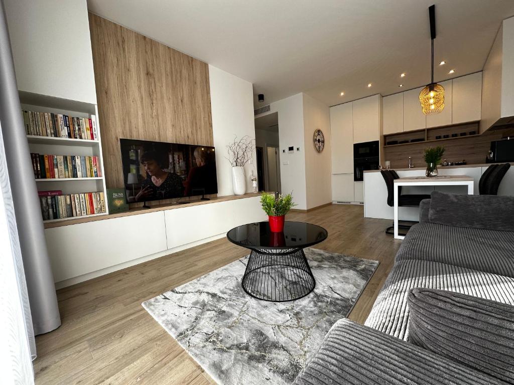 a living room with a couch and a table at Apartmán FILIP v centre Žiliny in Žilina