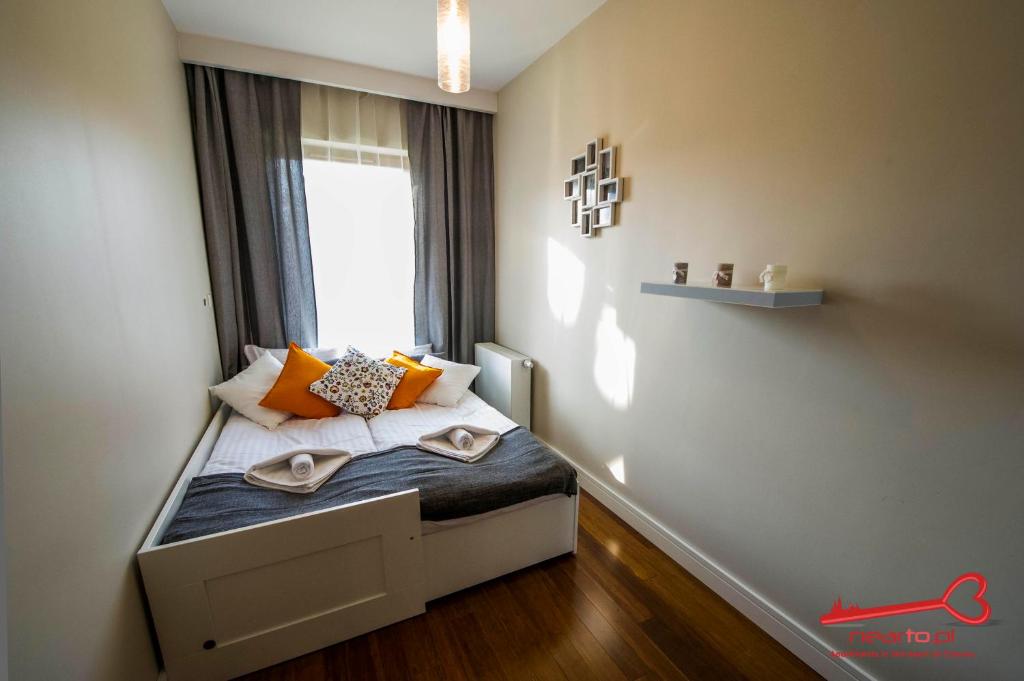 Posteľ alebo postele v izbe v ubytovaní Apartments Nearto Old Town Rakowicka