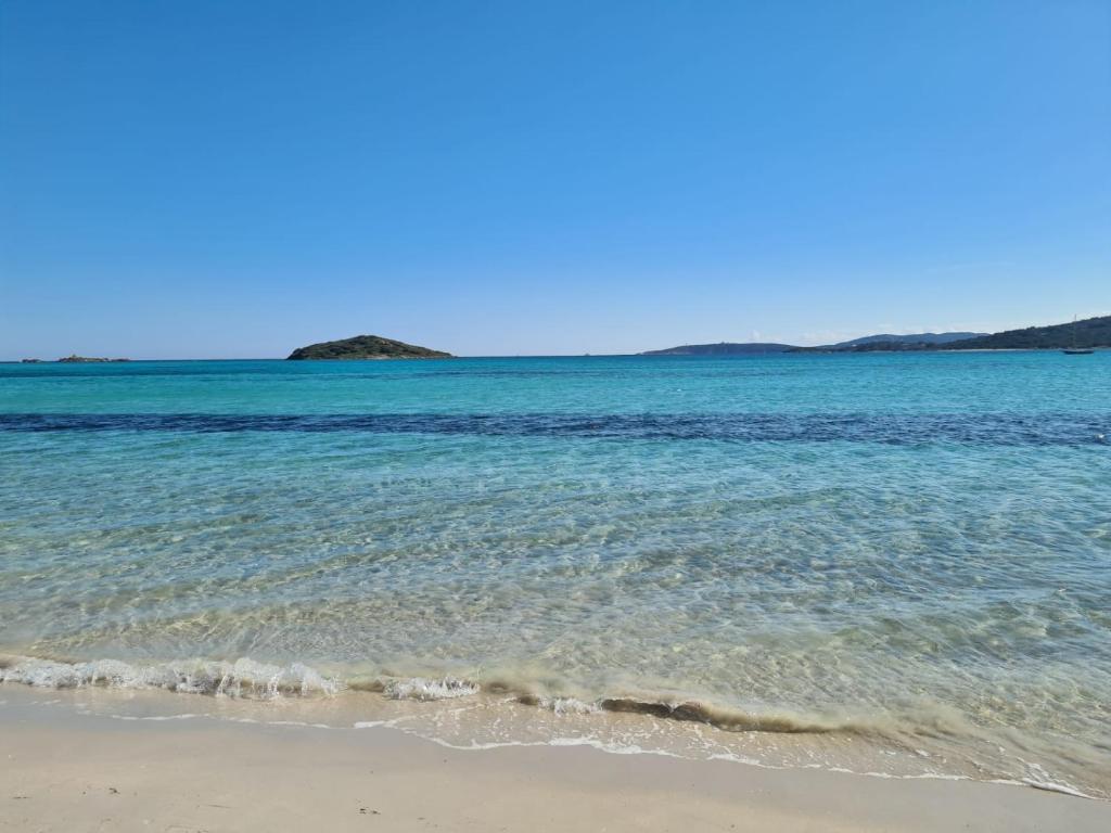 a view of the ocean from the beach at Casa ELYVMY in Zonza