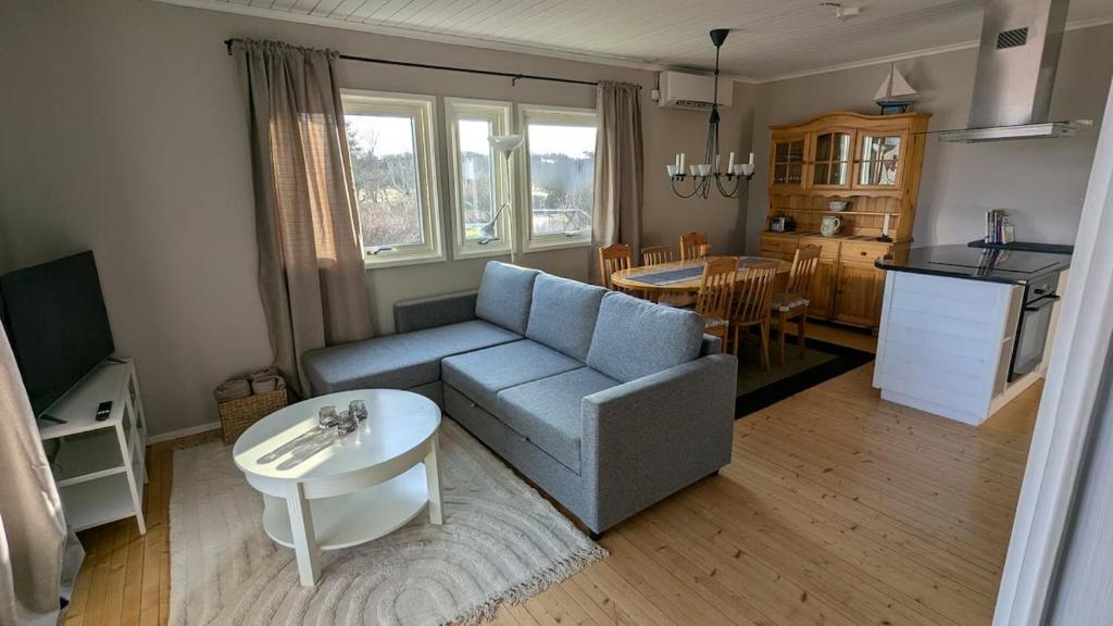 a living room with a couch and a table at Ebbas i Överboda in Överboda