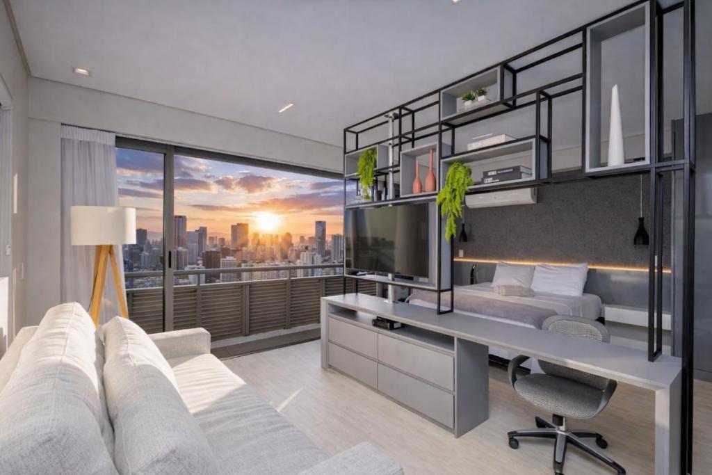 a bedroom with a desk and a view of the city at Apartamento Premium - Melhor vista de Curitiba in Curitiba