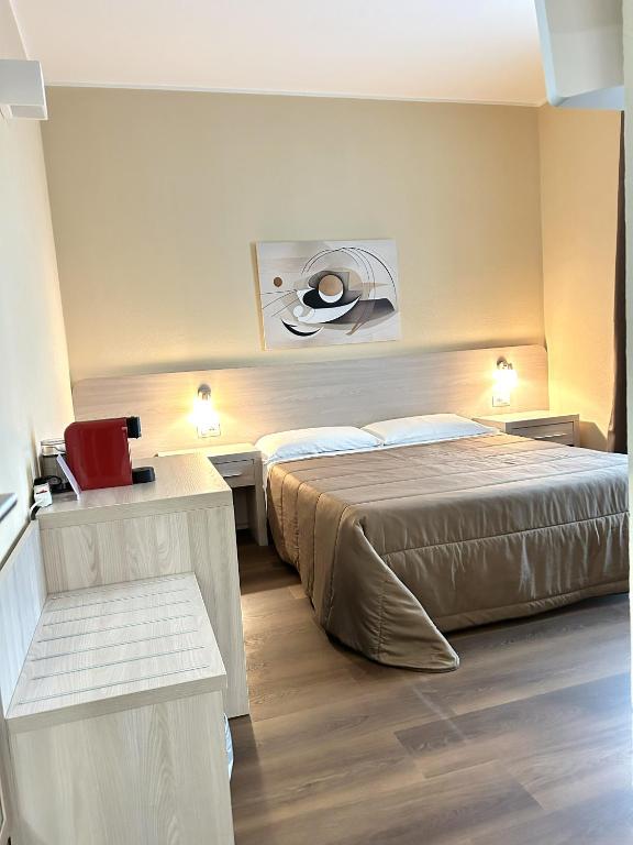 a hotel room with a bed and a window at Affittacamere In Centro in Tortolì