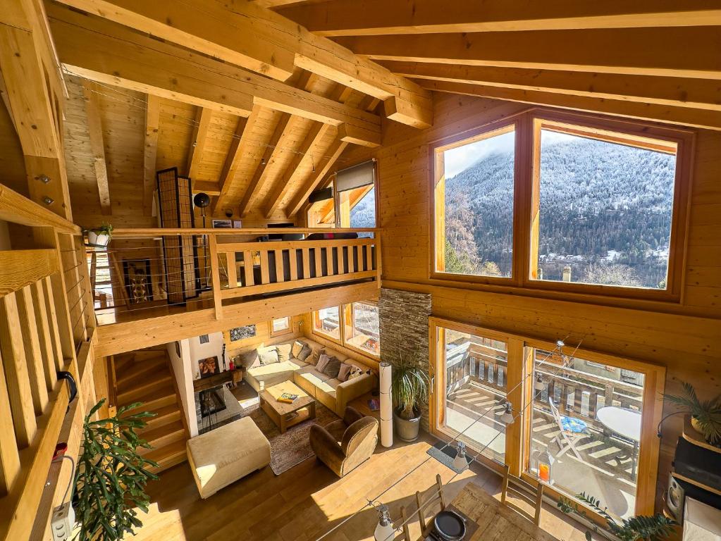 an overhead view of the living room of a log cabin at Chalet Boder - Vue MontBlanc - Cheminée in Finhaut