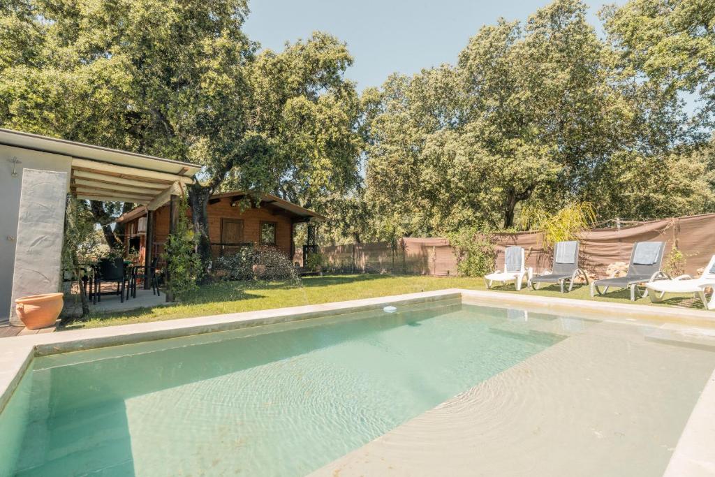 a swimming pool in the backyard of a house at Cabaña Rural El Arbol near Setenil - Ronda con piscina in Ronda