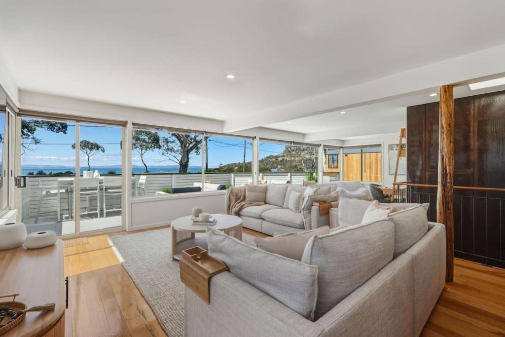 a living room with a couch and a table at Bunkers at Seven Mile in Seven Mile Beach