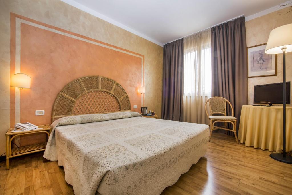 Postel nebo postele na pokoji v ubytování Hotel Le Pageot