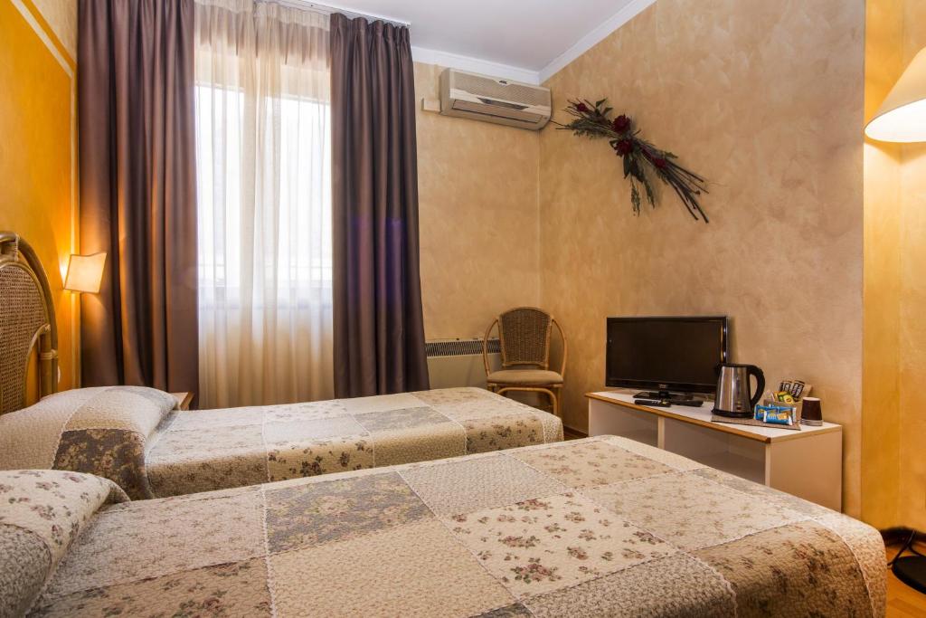 Postel nebo postele na pokoji v ubytování Hotel Le Pageot