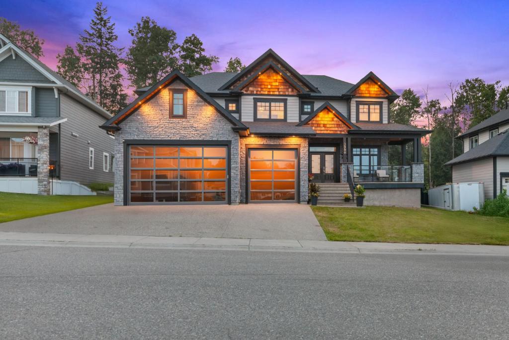 a large house with a garage at Hearthside Estate in Prince George